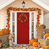 front entrance to single-family home decorated for autumn